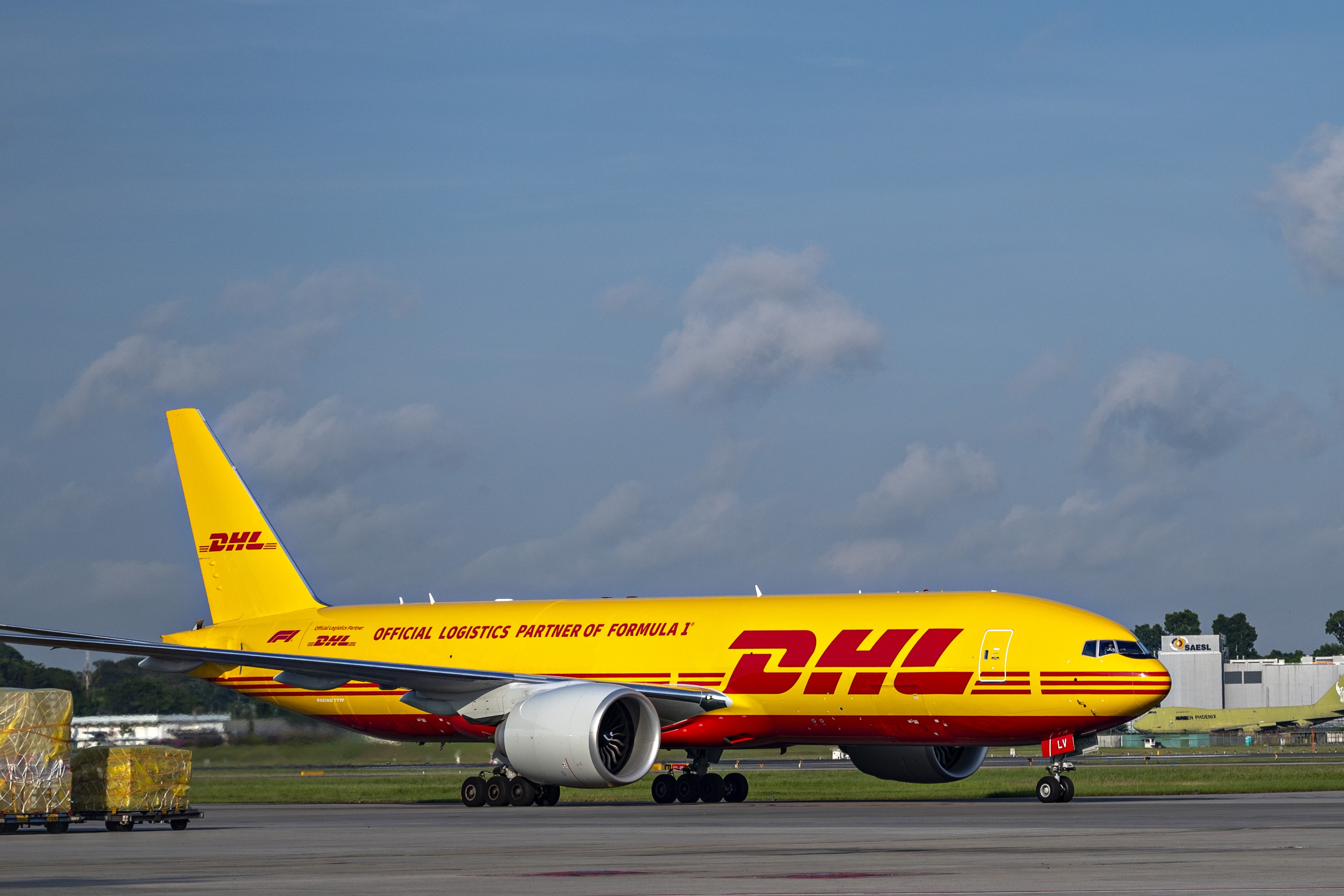 The first DHL x Formula One co-branded Boeing 777 landing at Changi Airport, Singapore