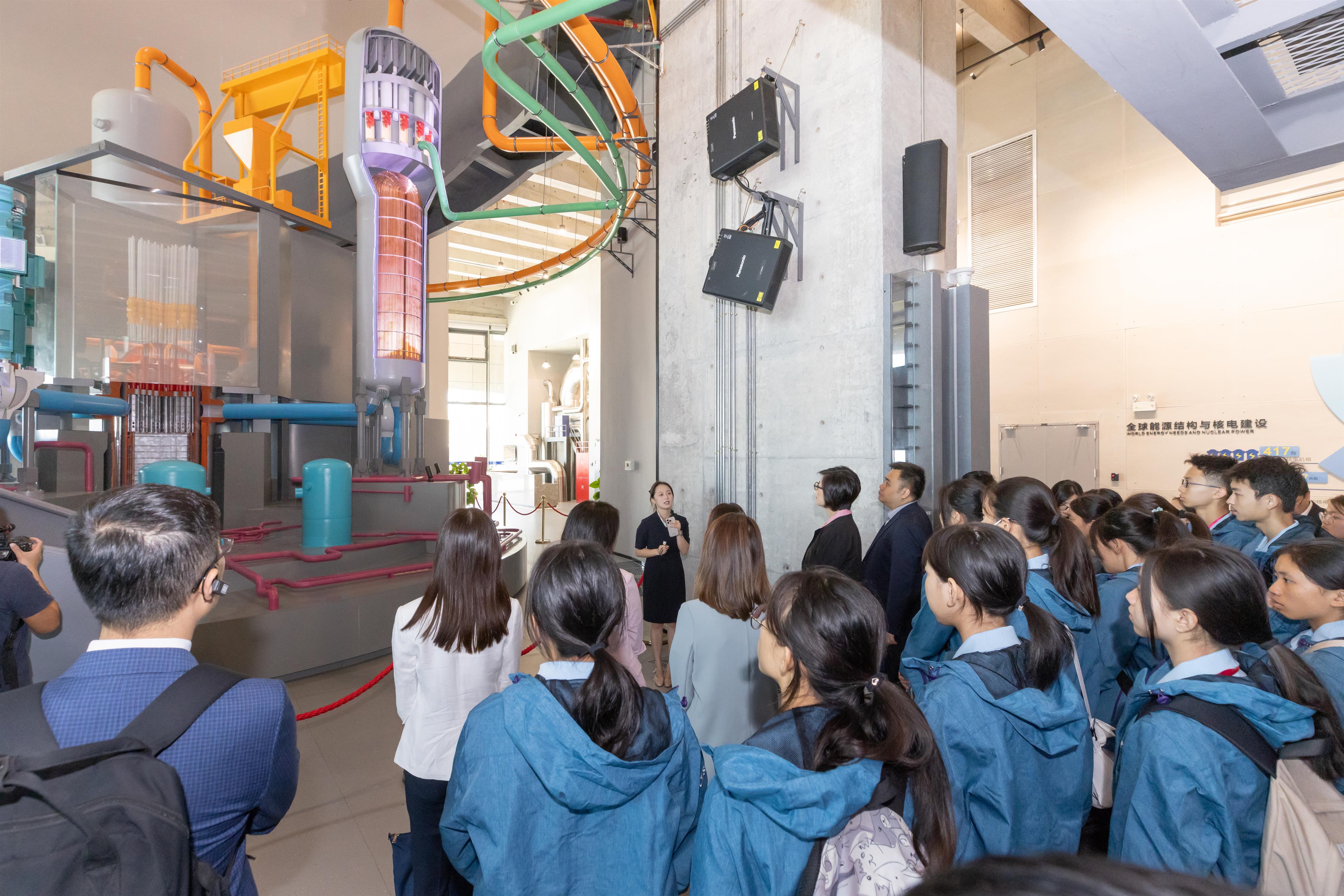 The students watch the Hualong One nuclear reactor model and other exhibits at the Daya Bay Nuclear Power Science and Technology Museum, learning about China’s third-generation nuclear power technology.