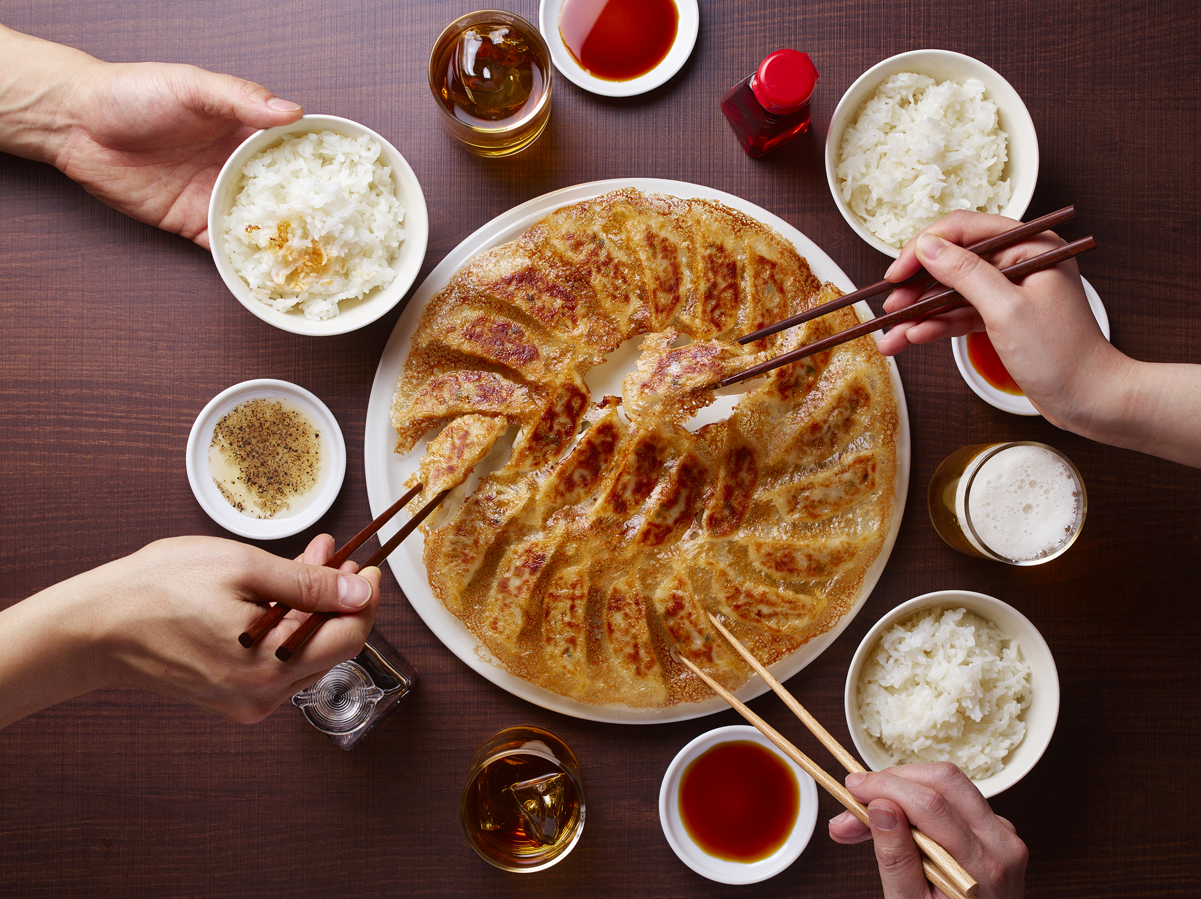 *Fried Gyoza with the perfect HANE paired with beer, sauce, and rice in a traditional Japanese meal.